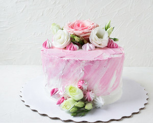 Delicious birthday cake with fresh flowers.