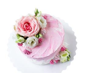 Delicious birthday cake with fresh flowers.