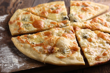 Italian cuisine. Pizza on a wooden background