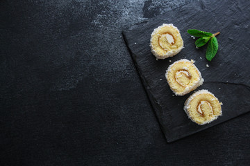 coconut sponge cake roll biscuit (delicious sweet dessert) menu concept. background. top view. copy space