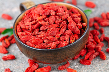 Cup with dried goji berry in close-up. Selective focus, above view