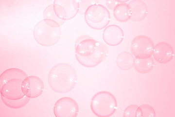 Beautiful pink soap bubbles float in the air, bubbles background