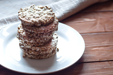 Wheat snacks on a wooden background. A healthy diet