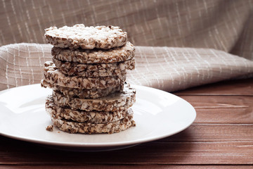 Wheat snacks on a wooden background. A healthy diet