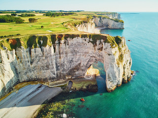 Picturesque panoramic landscape of white chalk cliffs and natural arches of Etretat, Normandy, France