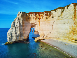 Picturesque panoramic landscape of white chalk cliffs and natural arches of Etretat, Normandy, France