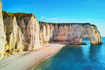 Picturesque panoramic landscape of white chalk cliffs and natural arches of Etretat, Normandy, France
