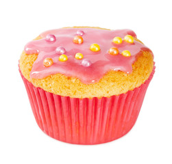 Vanilla muffin with pink icing and colored sprinkles