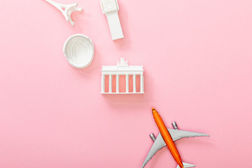 top view of toy plane near figurines with attractions on pink © LIGHTFIELD STUDIOS