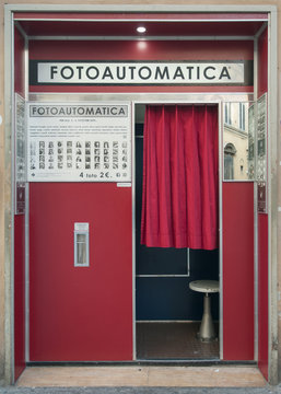 Florence, Italy - 2020, Jan 19: Old photo booth vending machine in a city street. It provides passport photo in a few minutes.