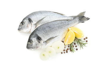 Fresh Dorado fishes and spices isolated on white background