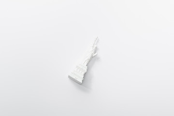 top view of little statue of liberty isolated on white © LIGHTFIELD STUDIOS