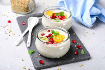 Fototapeta na wymiar Vegan Dessert, Green Buckwheat Mousse, Yogurt, Healthy Breakfast
