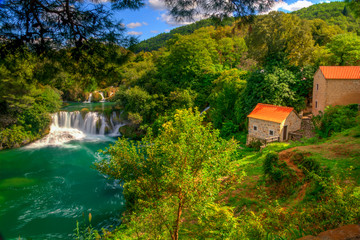 Fototapeta na wymiar Waterfalls and stone mill, Krka National Park, Dalmatia, Croatia.