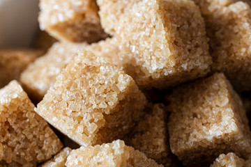 Pile of Golden Brown Sugar Cubes in Close Up
