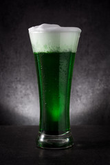 Traditional St Patrick's Day green beer on black background