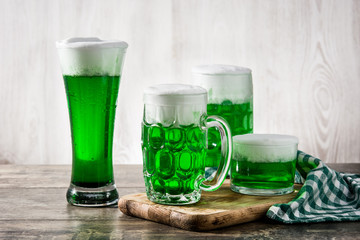 Traditional St Patrick's Day green beers on wooden table