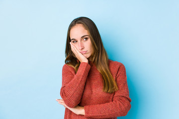 Young caucasian woman posing isolated  who is bored, fatigued and need a relax day.