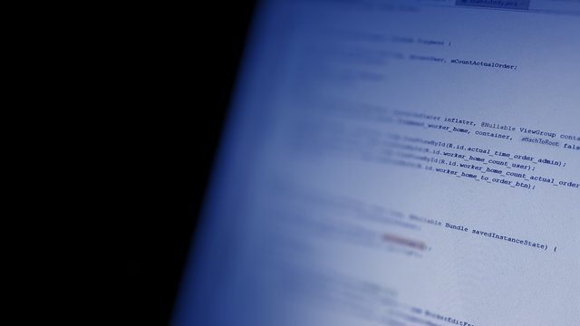  Android mobile development. Application source code on notebook  screen background.  Software developer programming code on computer. Abstract computer script source code.