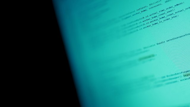  Android mobile development. Application source code on notebook green screen background.  Software developer programming code on computer. Abstract computer script source code.