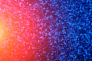Blue abstract background with blurred bokeh with bright light.