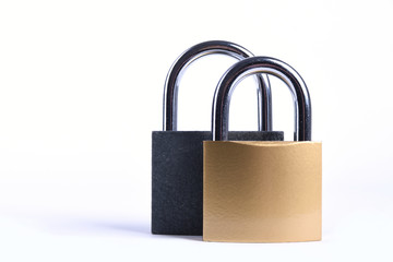 Two Locked grey and golden Padlock on the white background.