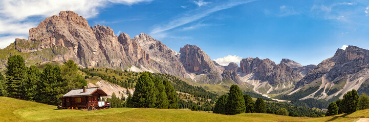 Panoramic view of Col Raiser Alp with the mountains of the Geisler Group in the background,...