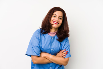 Middle age latin nurse woman isolated çlaughing and having fun.