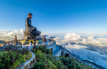 Landscape with .Giant Buddha statue on the top of mount Fansipan, Sapa region,  Lao Cai, Vietnam - obrazy, fototapety, plakaty