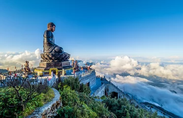 Zelfklevend Fotobehang Landscape with .Giant Buddha statue on the top of mount Fansipan, Sapa region,  Lao Cai, Vietnam © Serenity-H