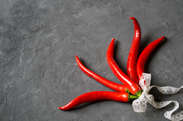 Red chili peppers on a gray background