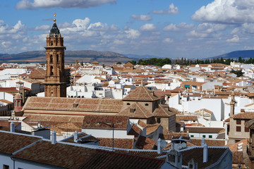 Fototapeta na wymiar AntequeAerial view on the roofs of the city of Antequera with the San Sebastian church in front; Malaga province, Spain, Europe