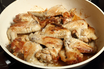 Frying chicken wings