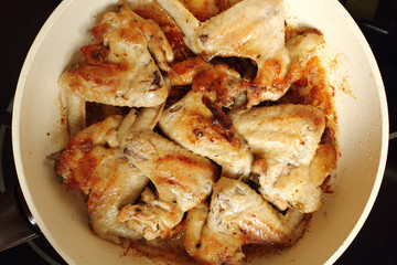 Frying chicken wings