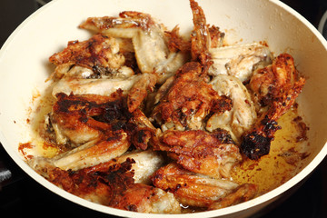 Frying chicken wings