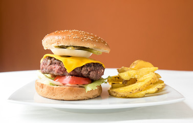 Big burguer over white background. Meal