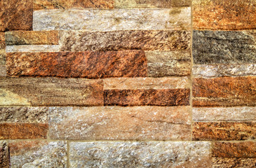 A background of colorful stone wall close up view