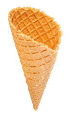 Vertical image of empty ice cream cone isolated on white background. Sweet wafer cone.