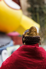 Fallas in Valencia. Fallera woman contemplates a monument of the city.