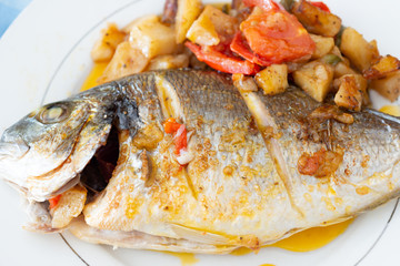 baked golden fish with potatoes