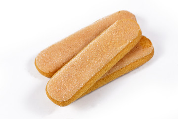 Fototapeta na wymiar Low density, dry, egg based, sweet sponge biscuits roughly shaped like a large finger called 'ladyfinger' on white background