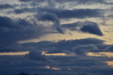 Fototapeta na wymiar winter snow clouds at sunset