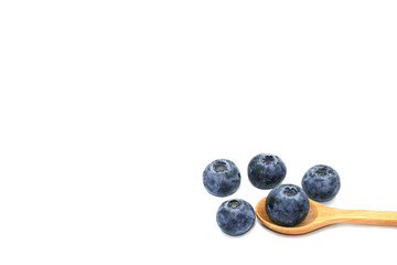 group of blueburry fruit in wooden spoon. Isolated on white background copy space for text.