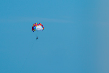 skydiving against the sky at sea