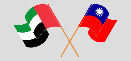 Crossed and waving flags of Taiwan and the United Arab Emirates