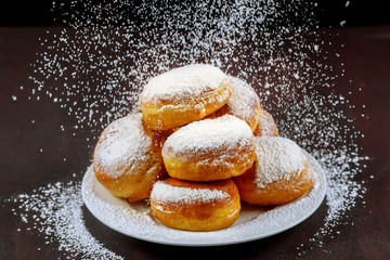Homemade american donuts sprinkling with powder sugar.