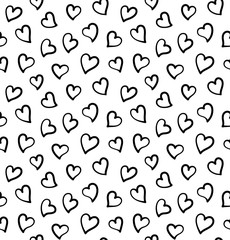 Seamless pattern or background with small black hearts. Design for Saint Valentine's Day Cards. Hand drawn hearts isolated on white.