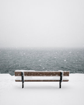 Bench chair covered in snow in Stanley park © Max