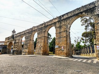 Fototapeta na wymiar ancient historic aqueduct in the city