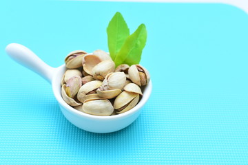 Pistachios in colorful and natural backgrounds